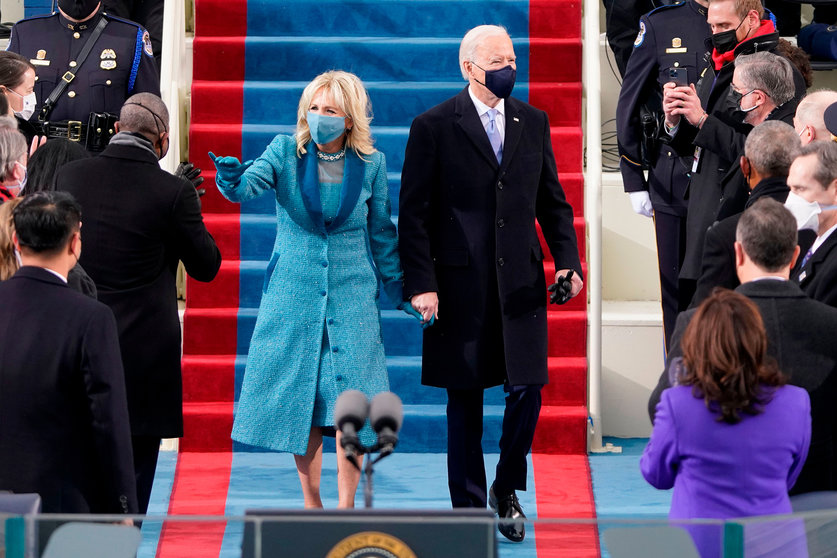 US President-elect Joe Biden flanked by wife Dr. Jill Biden arriving for his inauguration as the 46th US President on January 20, 2021, at the US Capitol in Washington, DC. (Patrick Semansky AFP/Getty Images)