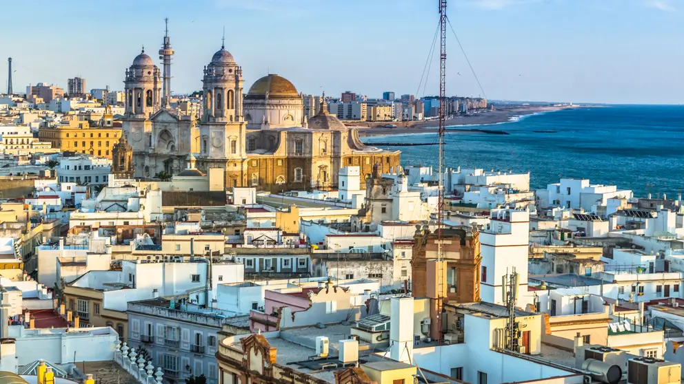 Cathedral of Cadiz at the atlantic coastline. Panorama of Cadiz in the golden light