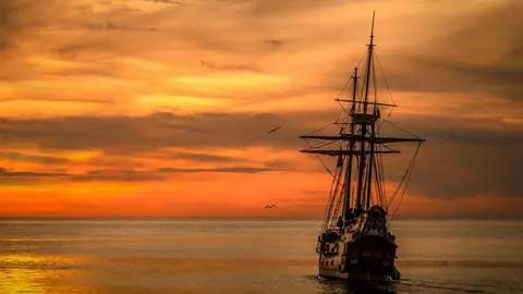 ship. https://www.pexels.com/photo/beach-dawn-dusk-ocean-189349/